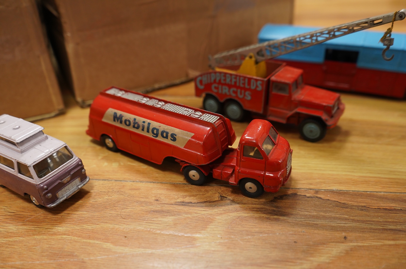 A collection of forty Corgi Toys and fourteen Matchbox Series diecast vehicles, including; The Man From Uncle Oldsmobile, a James Bond Aston Martin DB5 in gold, a Commer 5-ton truck with trailer and a selection of loads,